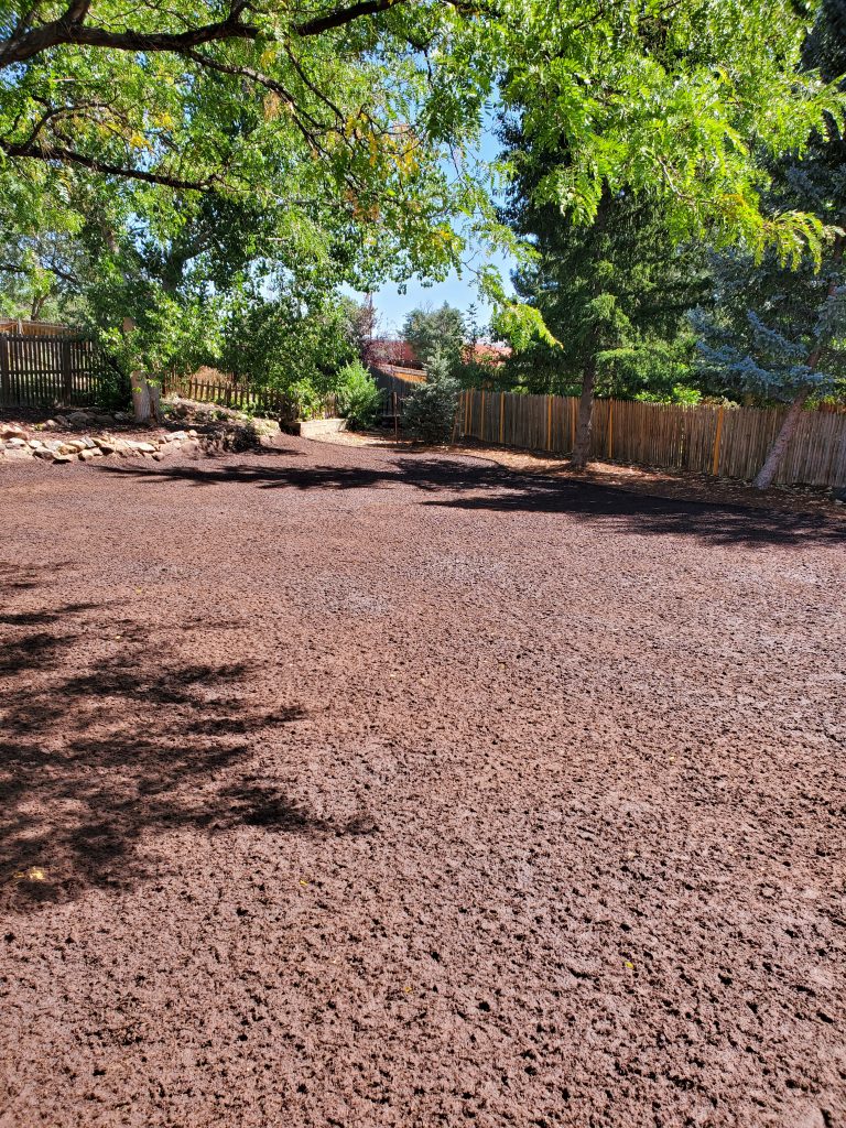A backyard prepared for hydroseeding with full top soil replacement such as Biotic soil media or hydraulic growth medium.